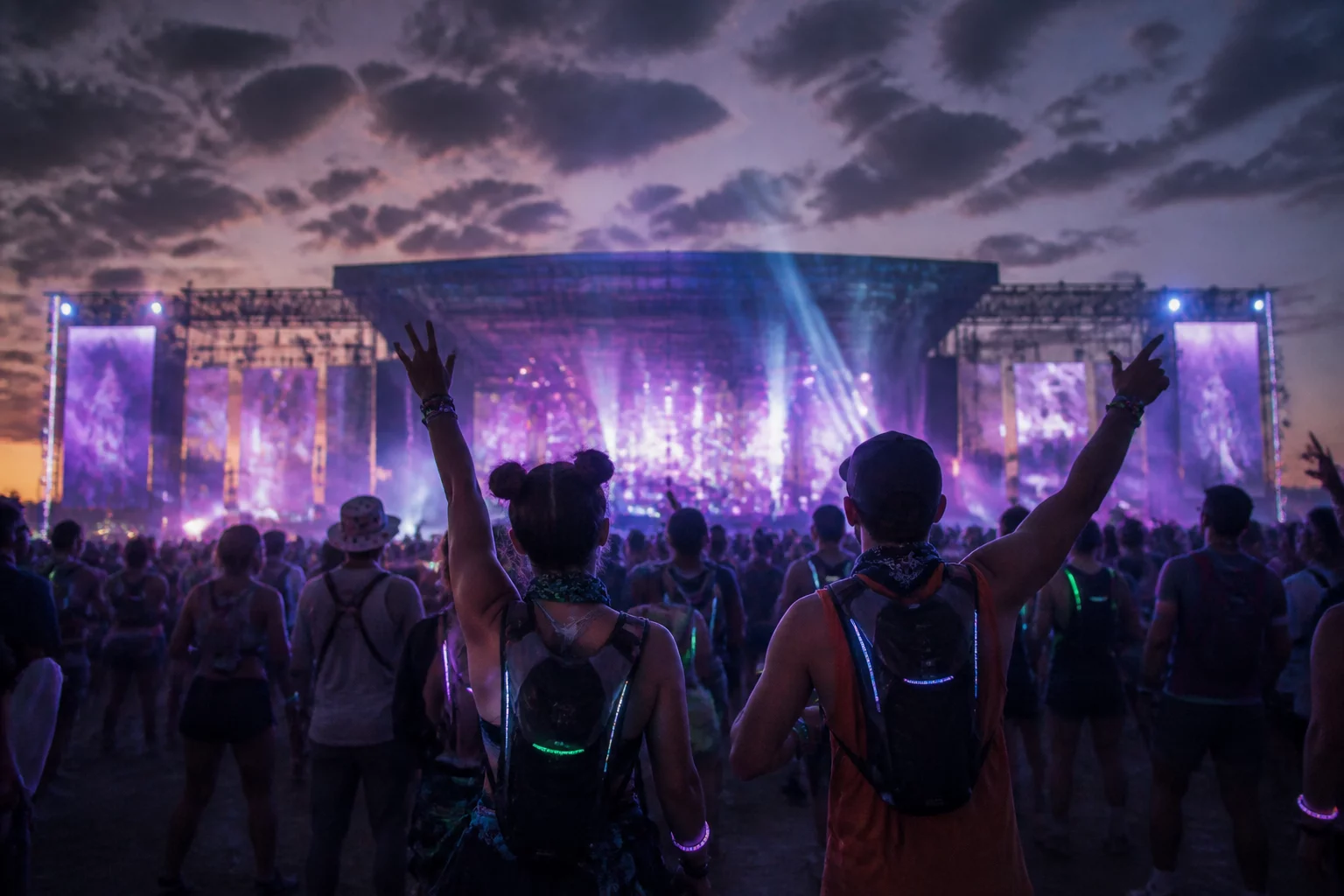 Open-air festival crowd with illuminated accessories